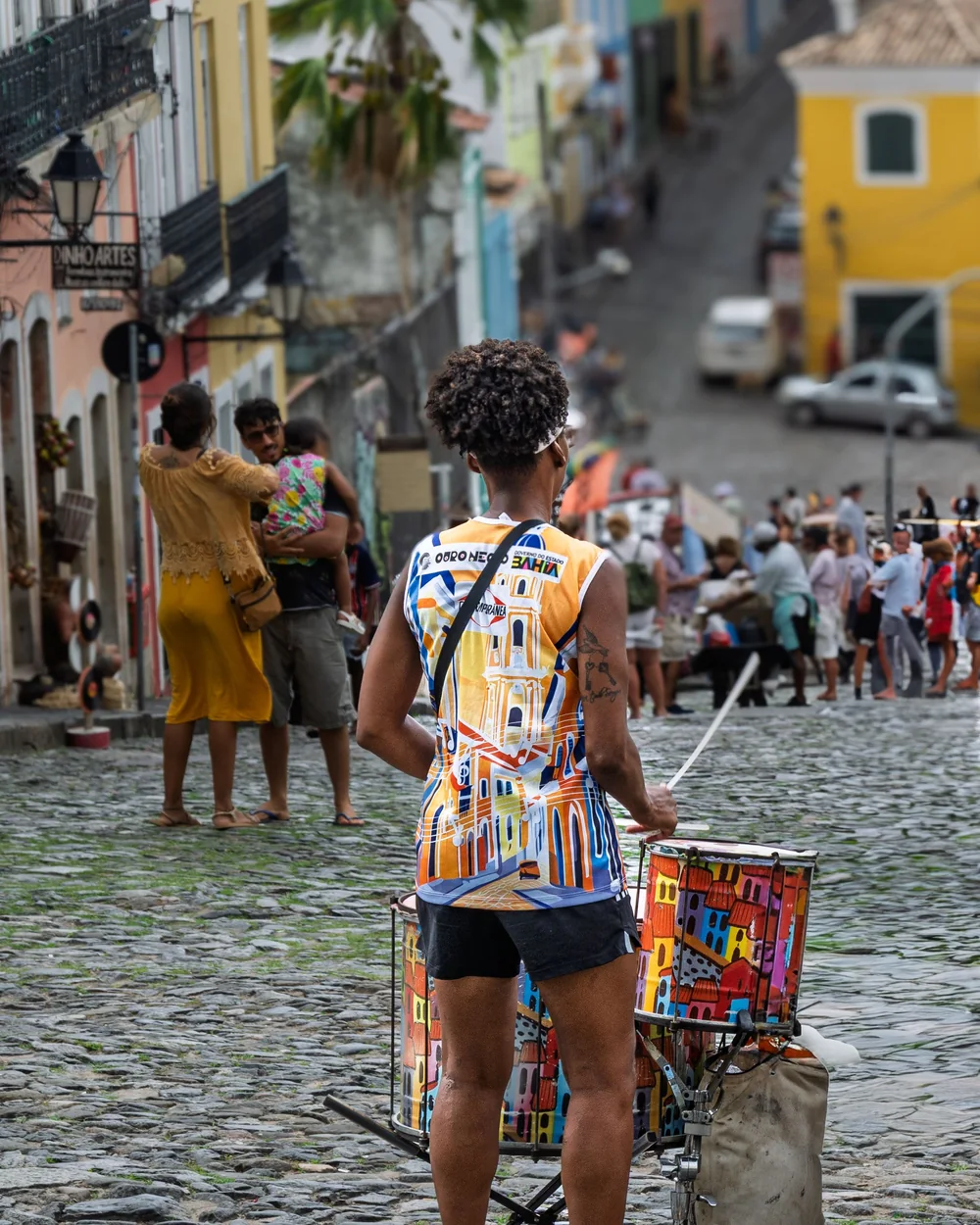 A street drummer stands in the colourful colonial square of the Pelourinho, Salvador